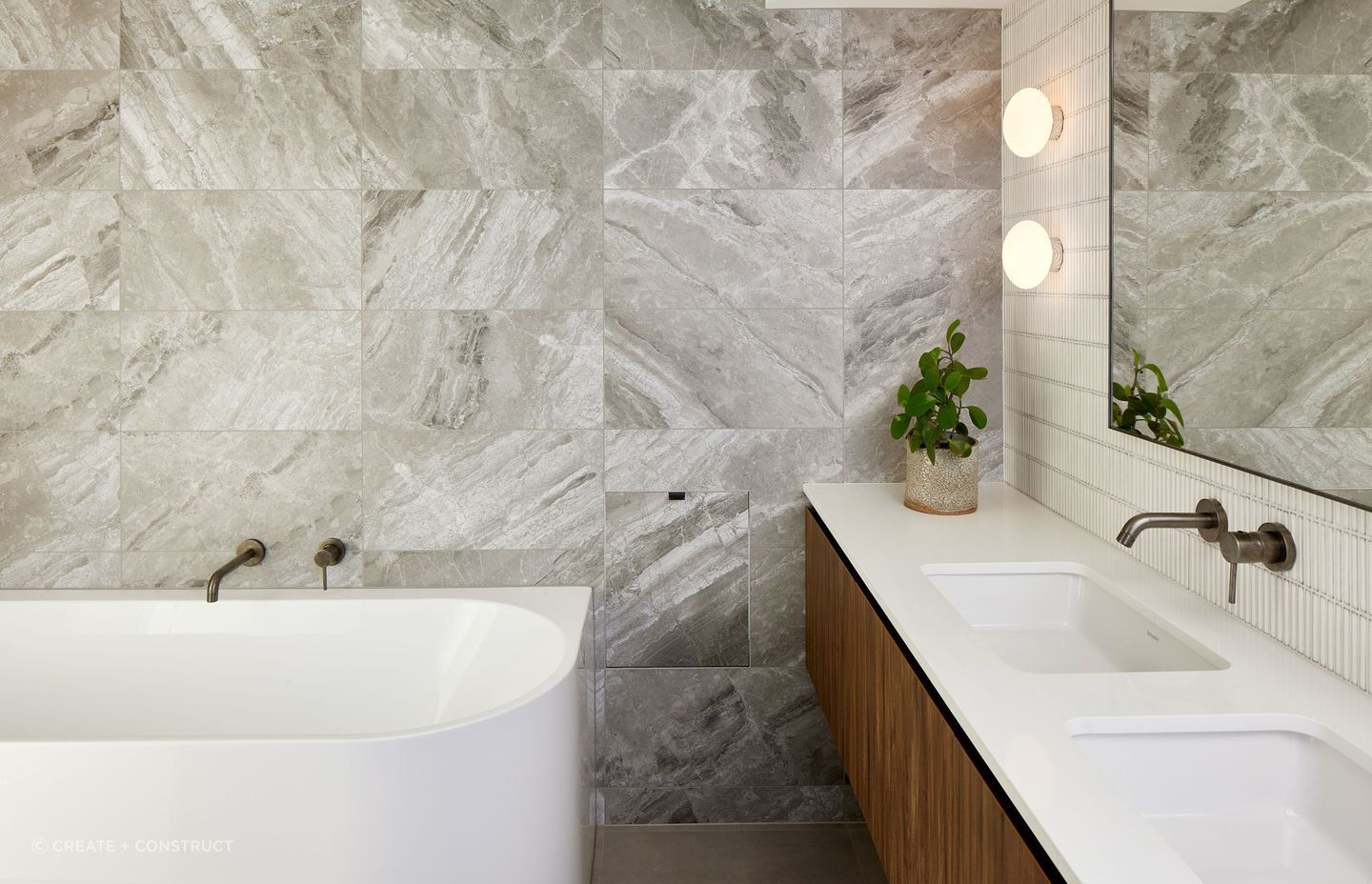 The beautiful marble veining featured in this Glendowie bathroom renovation gives an organic feeling to the space — Photography: Simon C Wilson