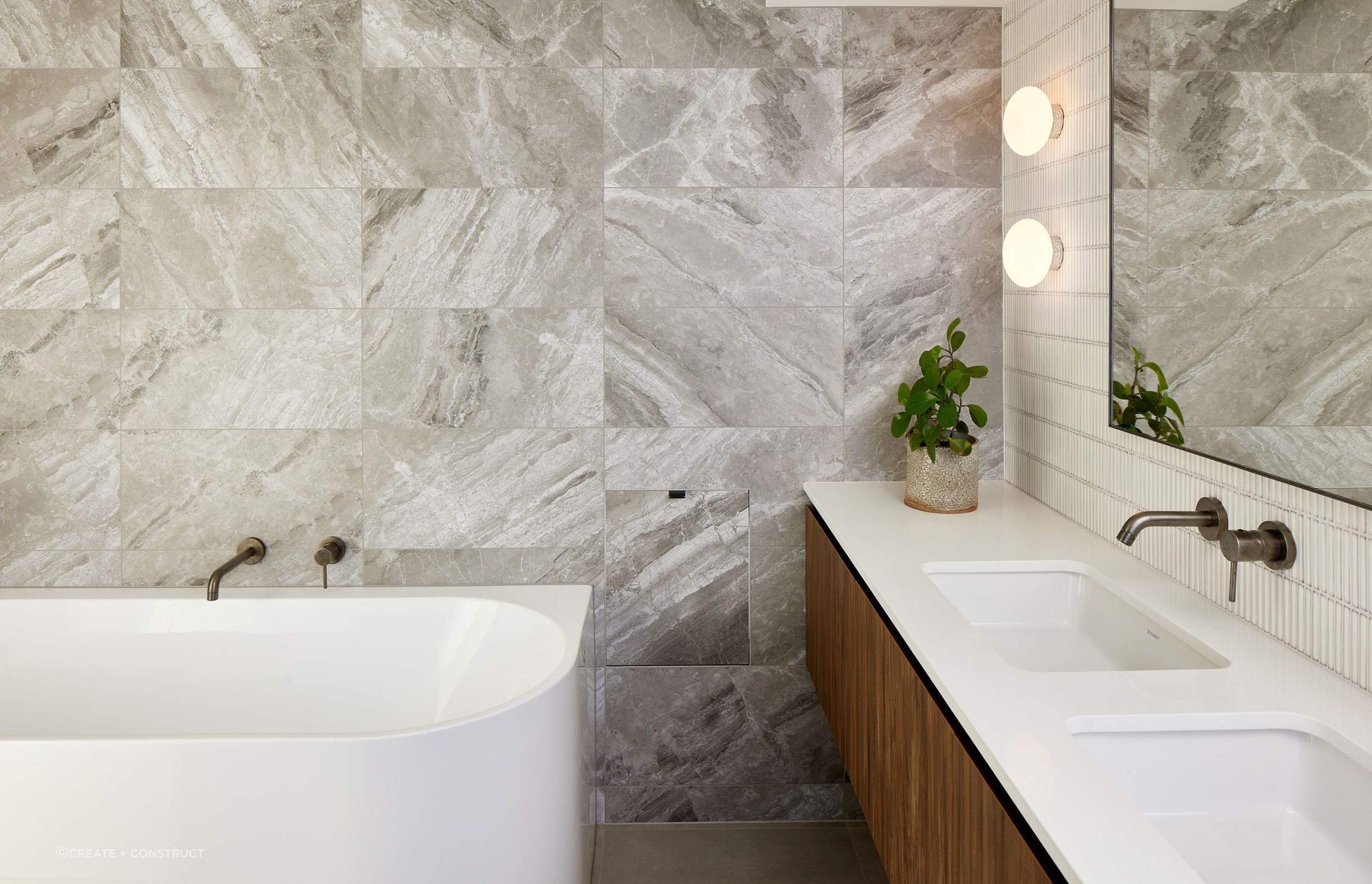 The beautiful marble veining featured in this Glendowie bathroom renovation gives an organic feeling to the space — Photography: Simon C Wilson