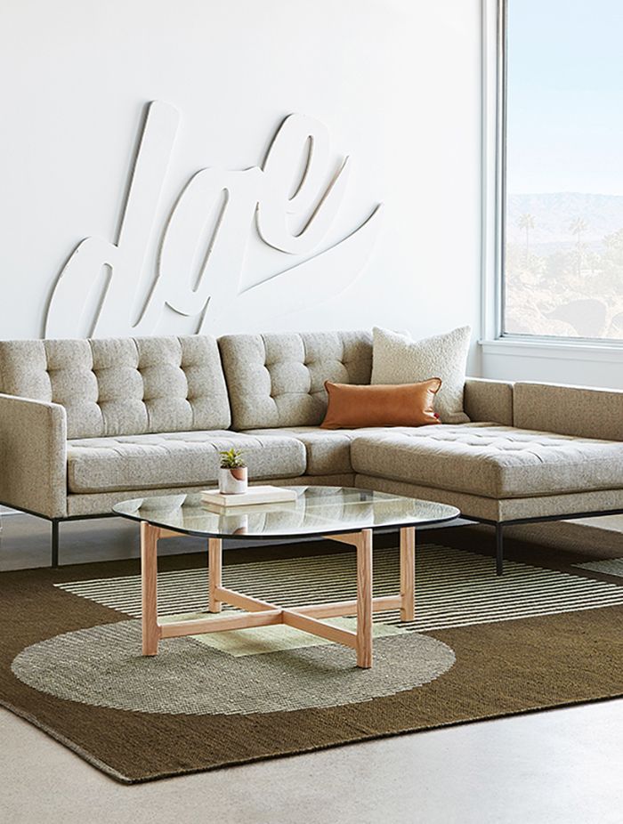Glass coffee tables can enhance a room's openness.