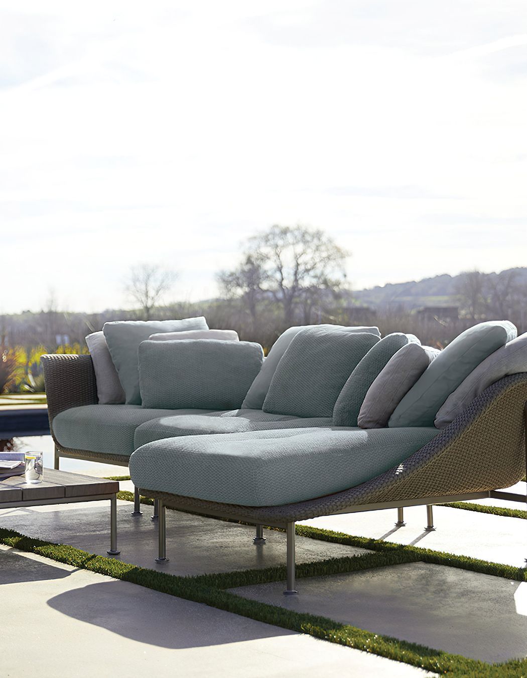 Outdoor chaise lounges are often built from hardy materials such as rattan and weather-resistant fabrics that help retain colour and minimise UV damage. Featured product: Gina Module Center.