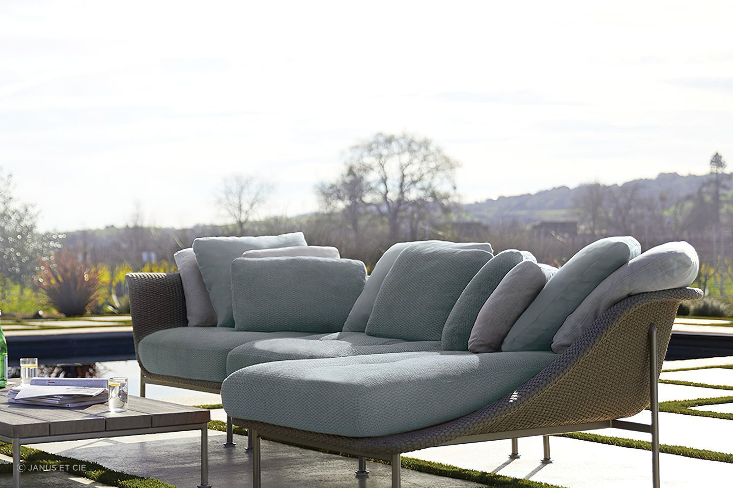 Outdoor chaise lounges are often built from hardy materials such as rattan and weather-resistant fabrics that help retain colour and minimise UV damage. Featured product: Gina Module Center.