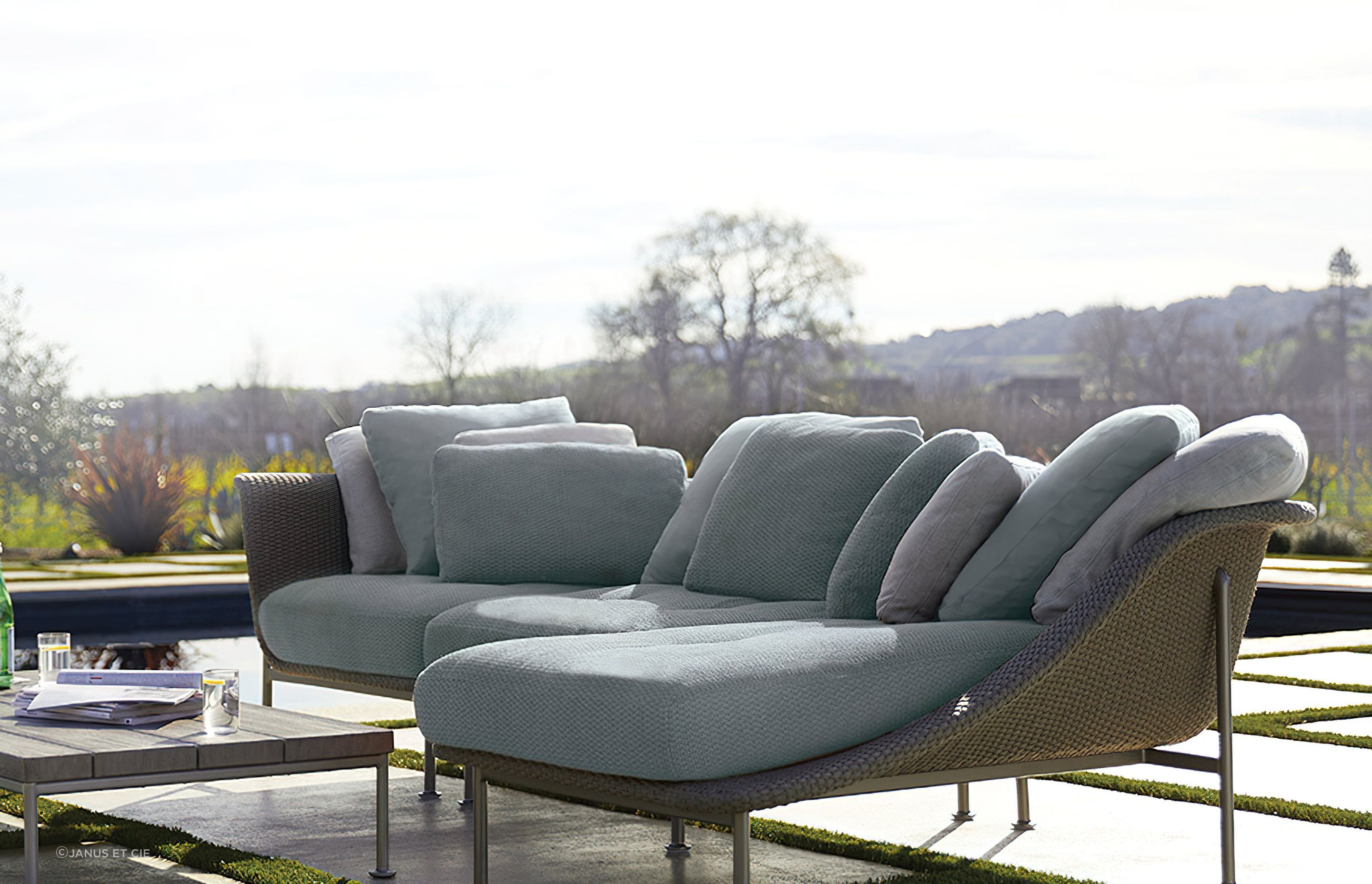 Outdoor chaise lounges are often built from hardy materials such as rattan and weather-resistant fabrics that help retain colour and minimise UV damage. Featured product: Gina Module Center.