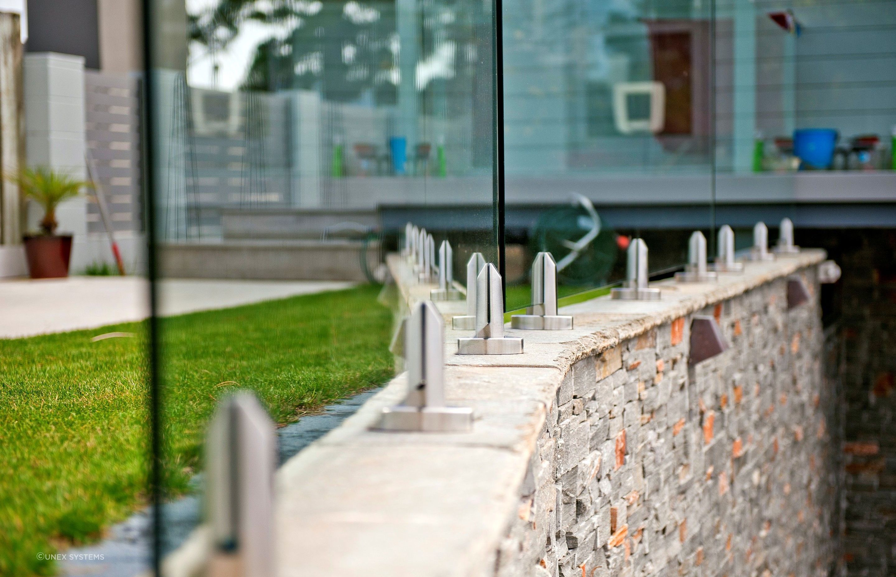 Safe, secure and stylish — the GlasStrut Glass Balustrades by Unex Systems.