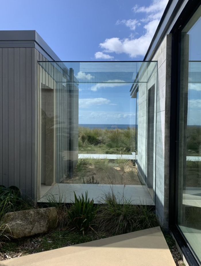 A glass link makes a contemporary junction between two separate forms.