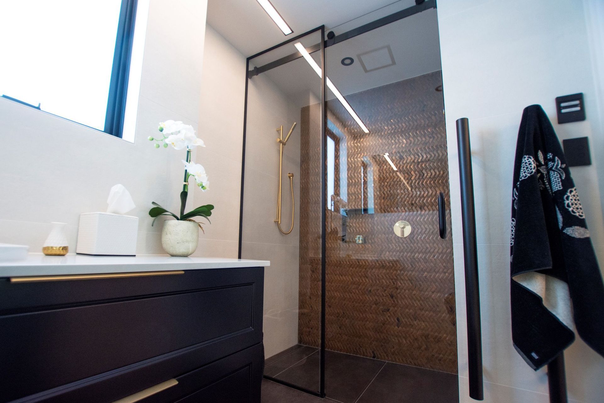 Sliding doors are great space savers and can be used as the entry door to your bathroom or for your shower as seen here.