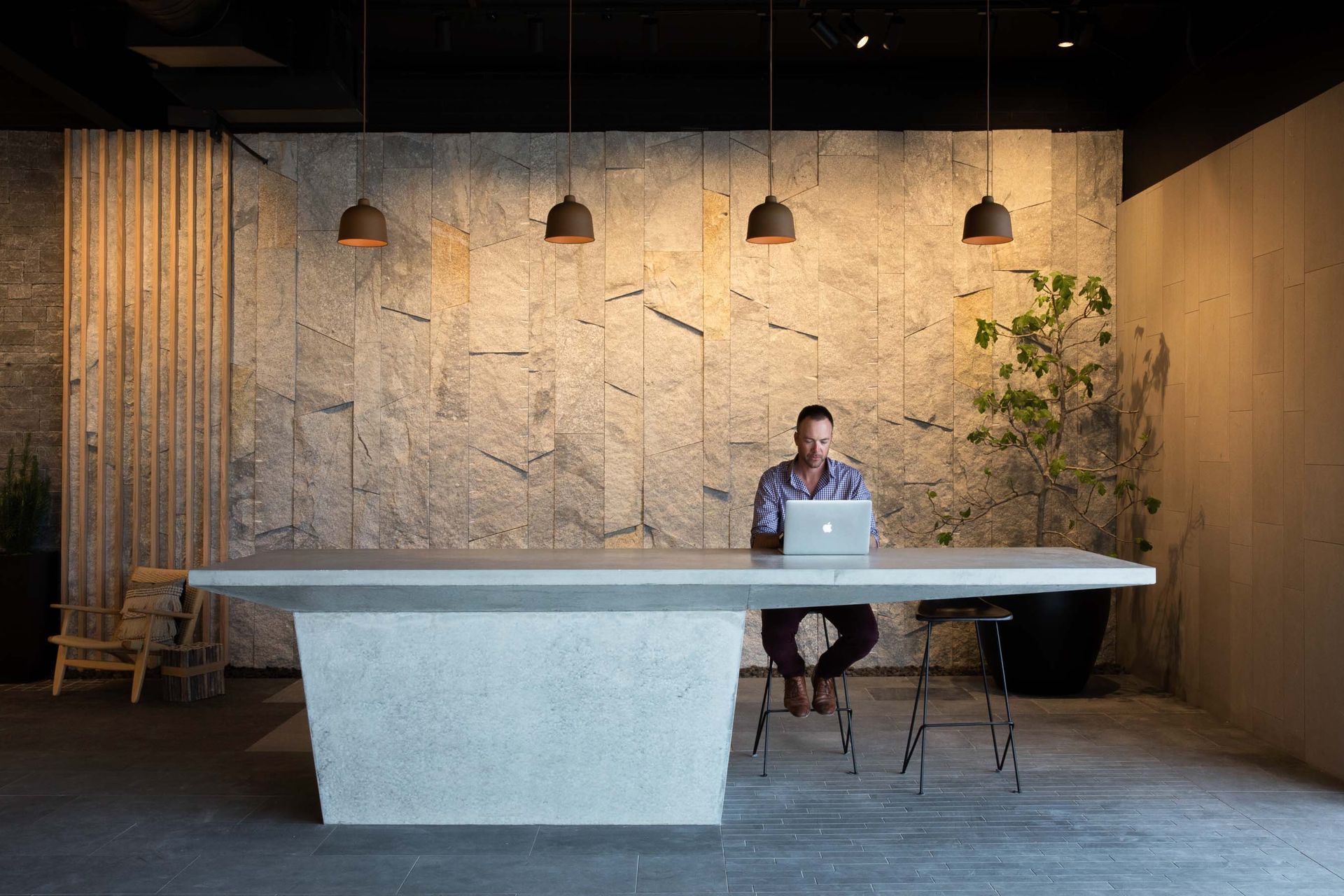 Granite stone wall cladding can be placed on a variety of interior walls in residential and commercial settings. Featured product: Preikestolen Vertical Stone Wall Cladding