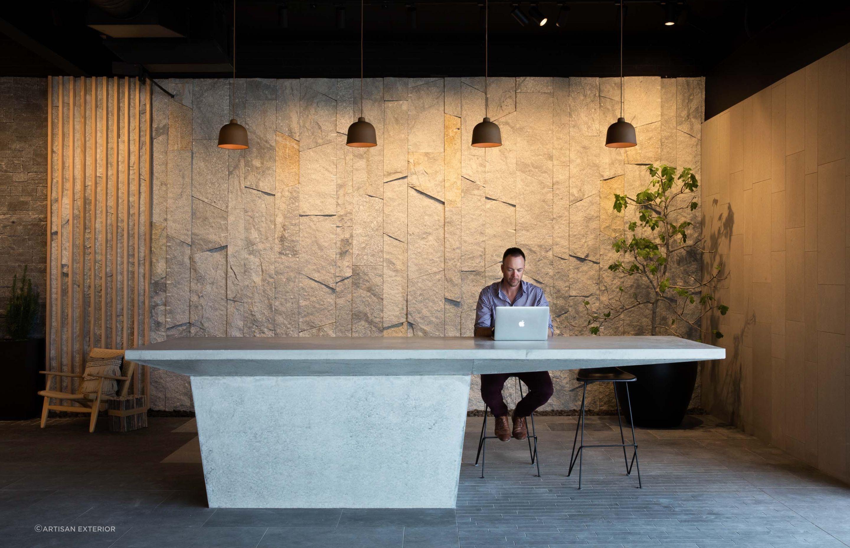 Granite stone wall cladding can be placed on a variety of interior walls in residential and commercial settings. Featured product: Preikestolen Vertical Stone Wall Cladding