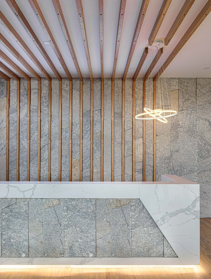 Granite stone wall cladding works well with different materials. Featured product: Preikestolen Vertical Stone Wall Cladding.