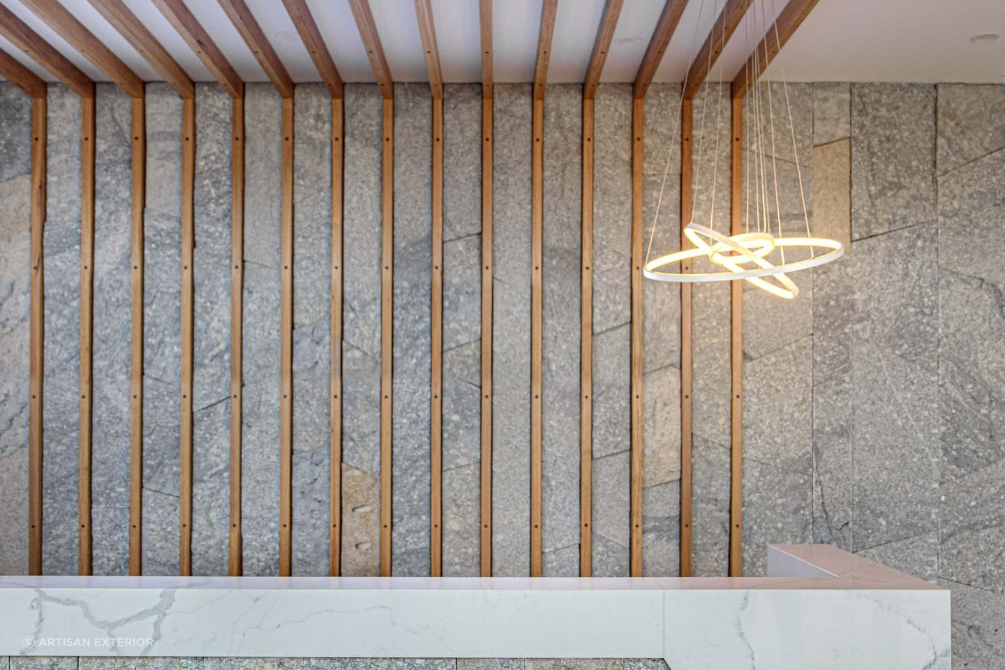 Granite stone wall cladding works well with different materials. Featured product: Preikestolen Vertical Stone Wall Cladding.