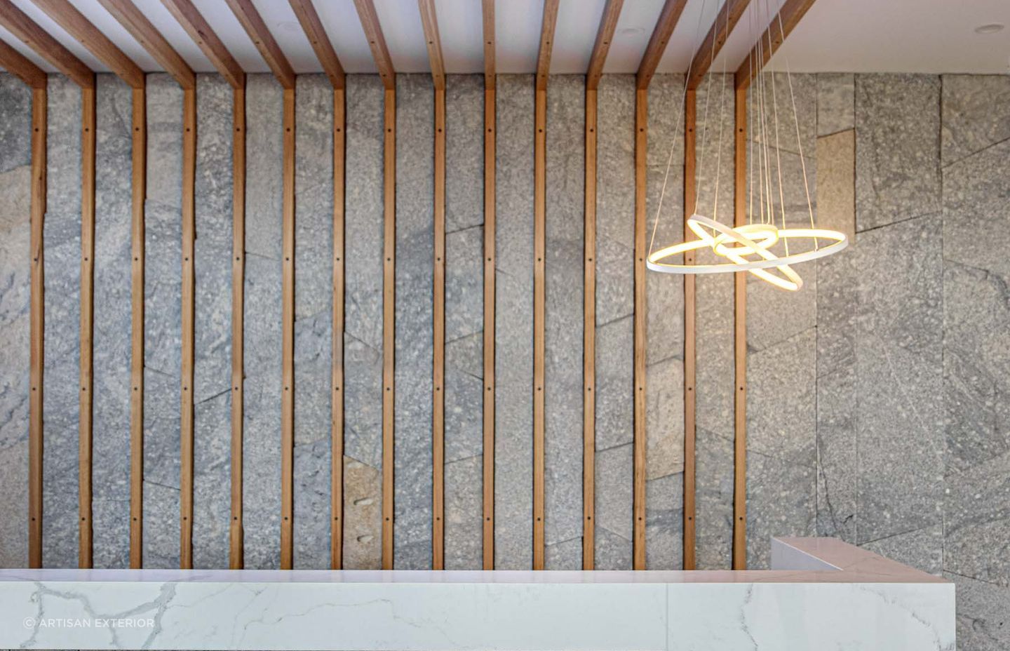 Granite stone wall cladding works well with different materials. Featured product: Preikestolen Vertical Stone Wall Cladding.