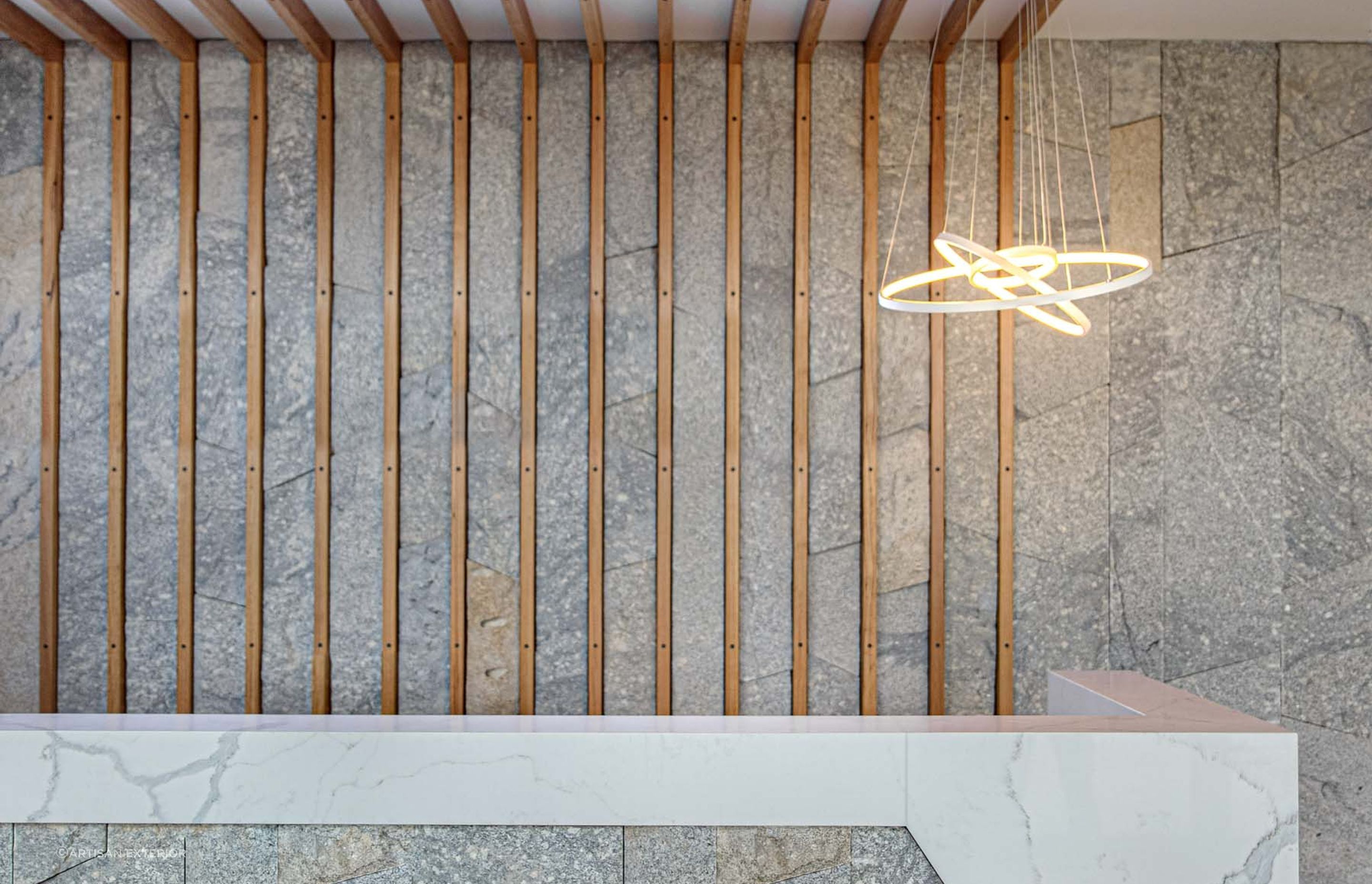 Granite stone wall cladding works well with different materials. Featured product: Preikestolen Vertical Stone Wall Cladding.