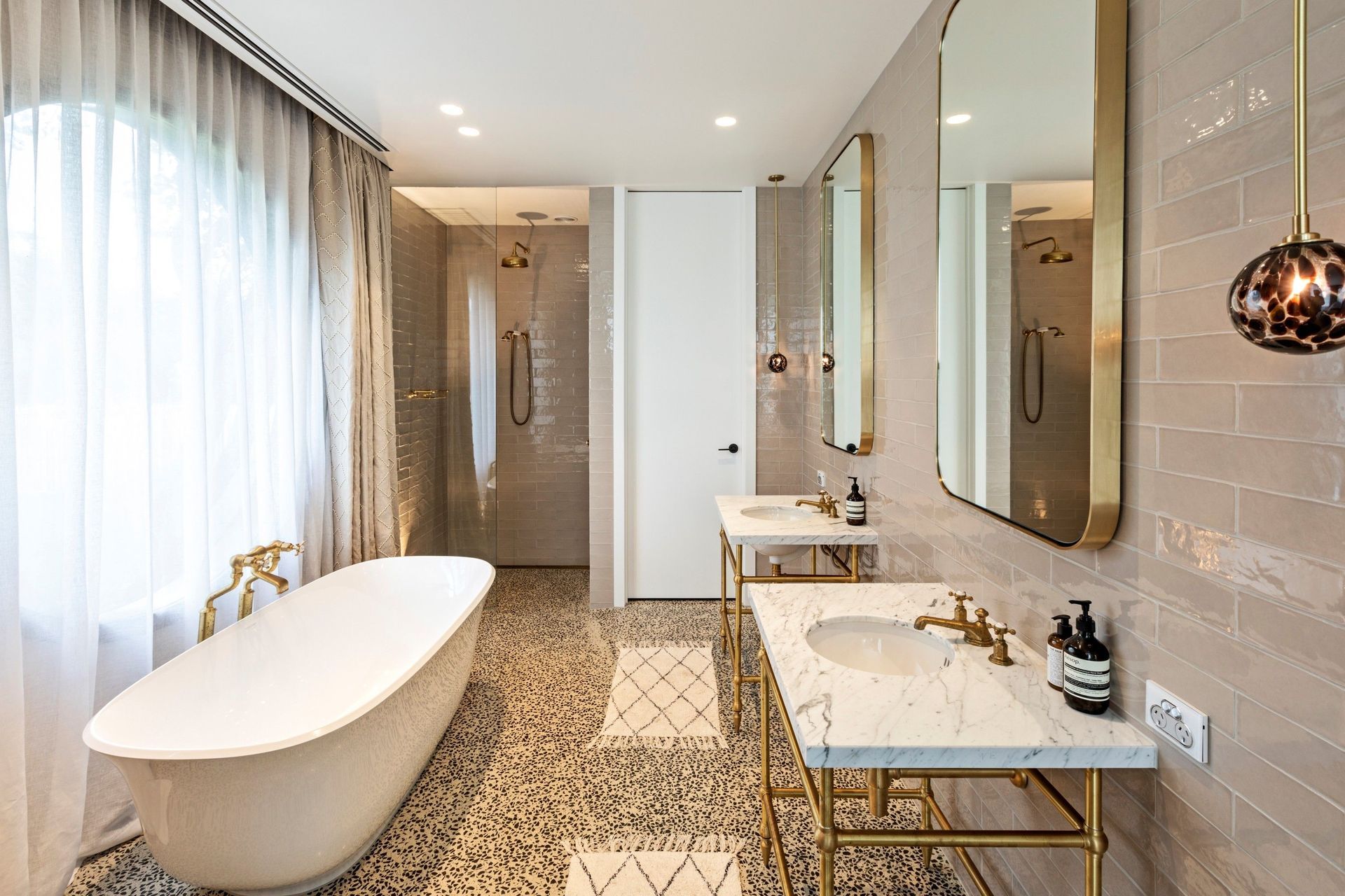 The Hawthorn Hill Basin Stand Vanity from In Residence, featuring an undermount basin, allowing its beautiful finish to shine.