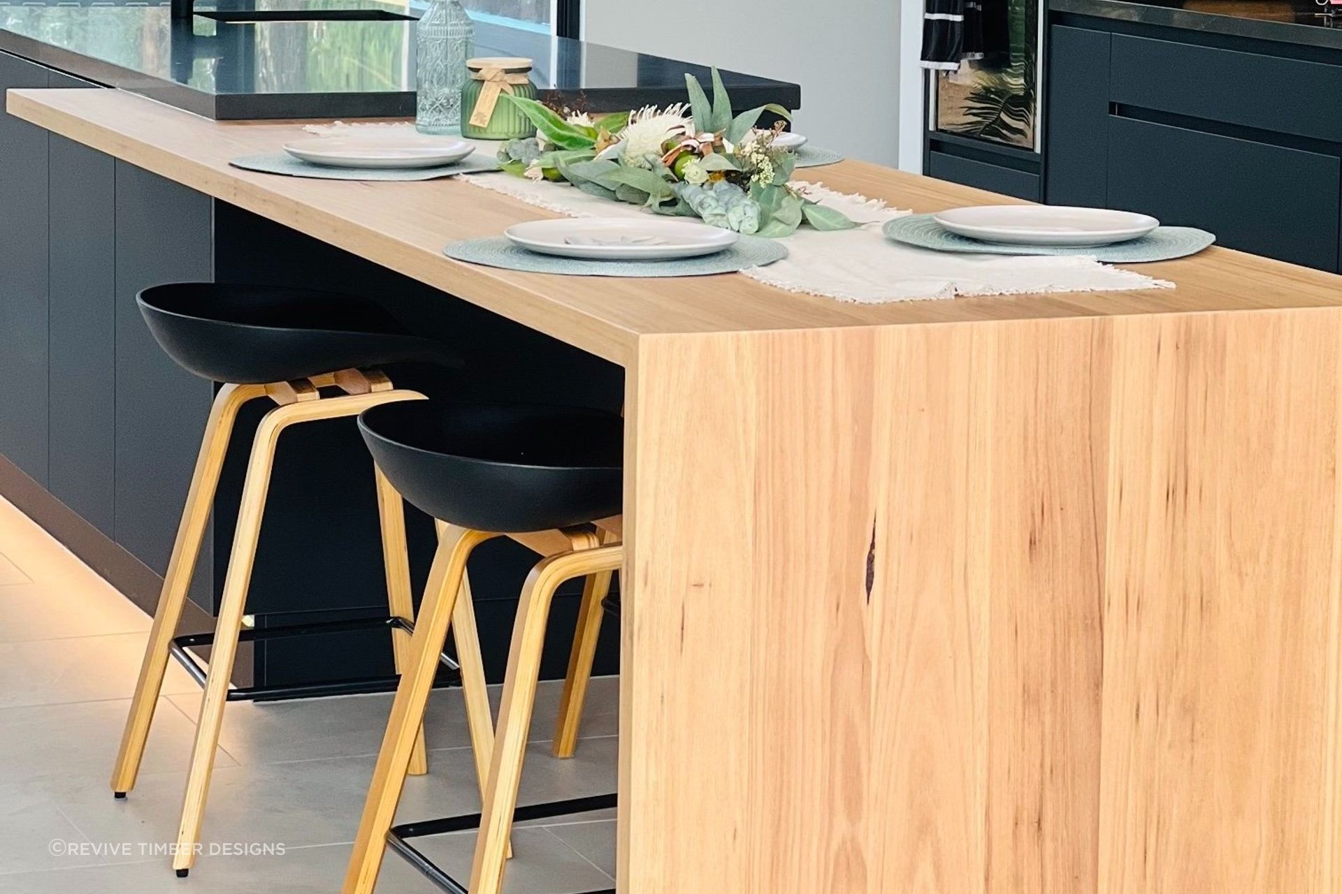 Stunning wooden benchtops like these Handcrafted Timber Benchtops by Revive Timber Designs bring instant warmth to a kitchen.