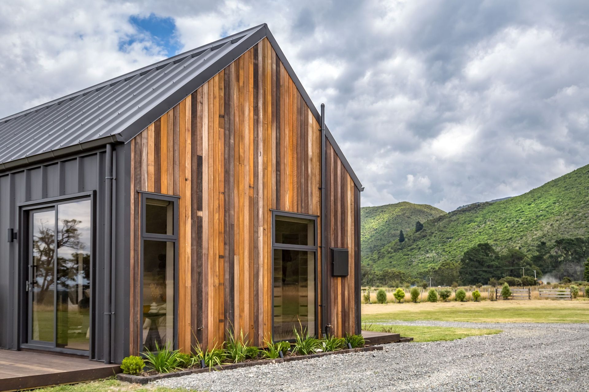 A stunning example of Mixed Species Hardwood Cladding in Vertical Shiplap from Hardwood Timbers NZ.