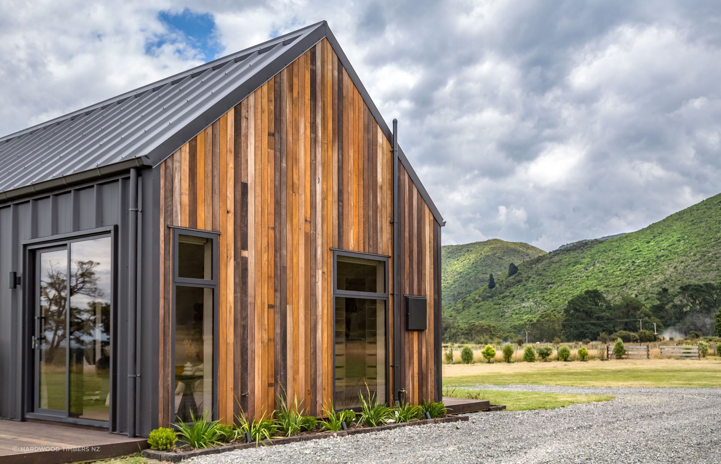 A stunning example of Mixed Species Hardwood Cladding in Vertical Shiplap from Hardwood Timbers NZ.