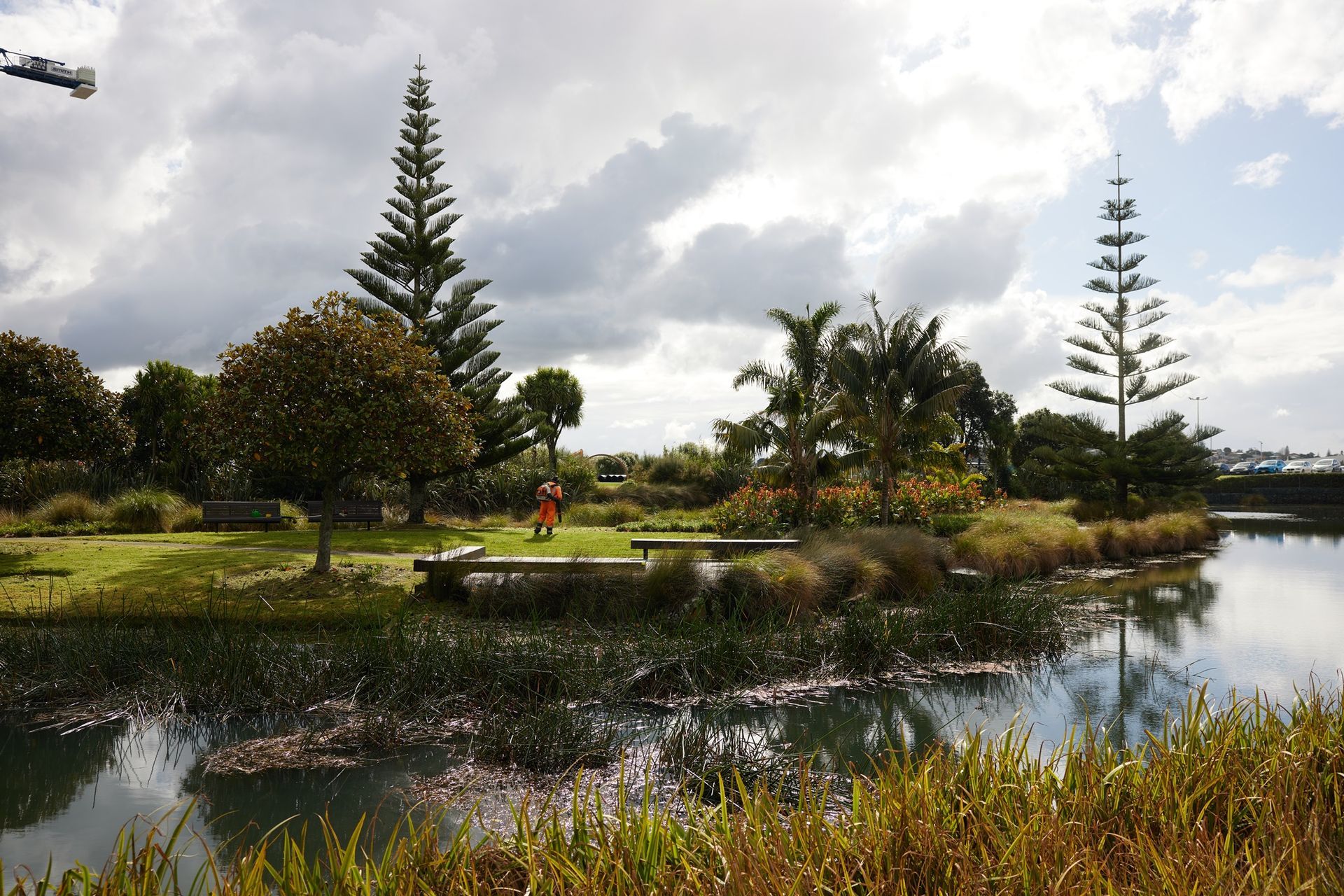 A gardener from Natural Habitats maintains the beautiful grounds of Healthcare Park.