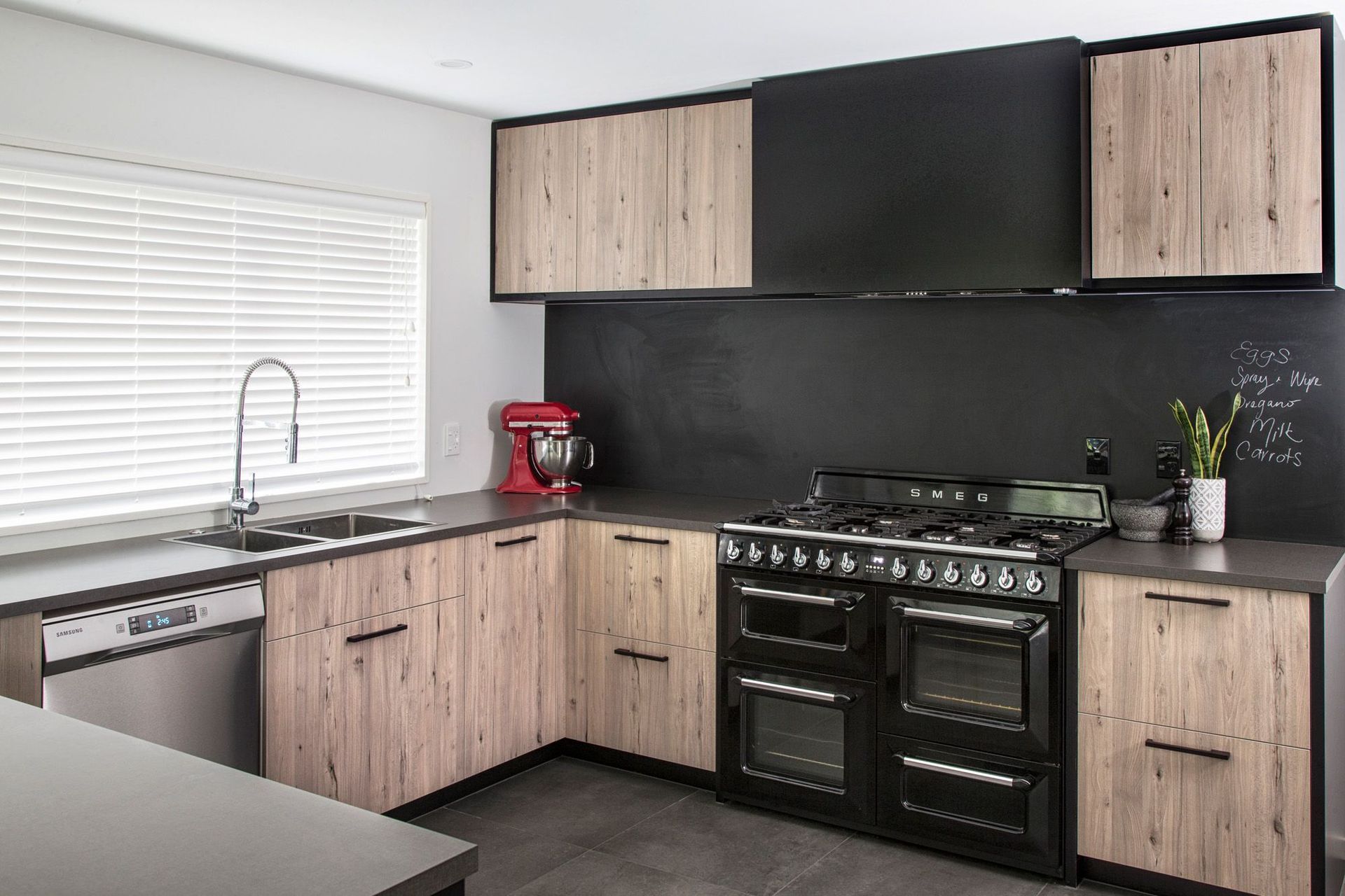 Kitchen appliances can also be used for design purposes, like a vibrant injection of colour seen in this Parklands Kitchen by Modern Age Kitchens and Joinery.