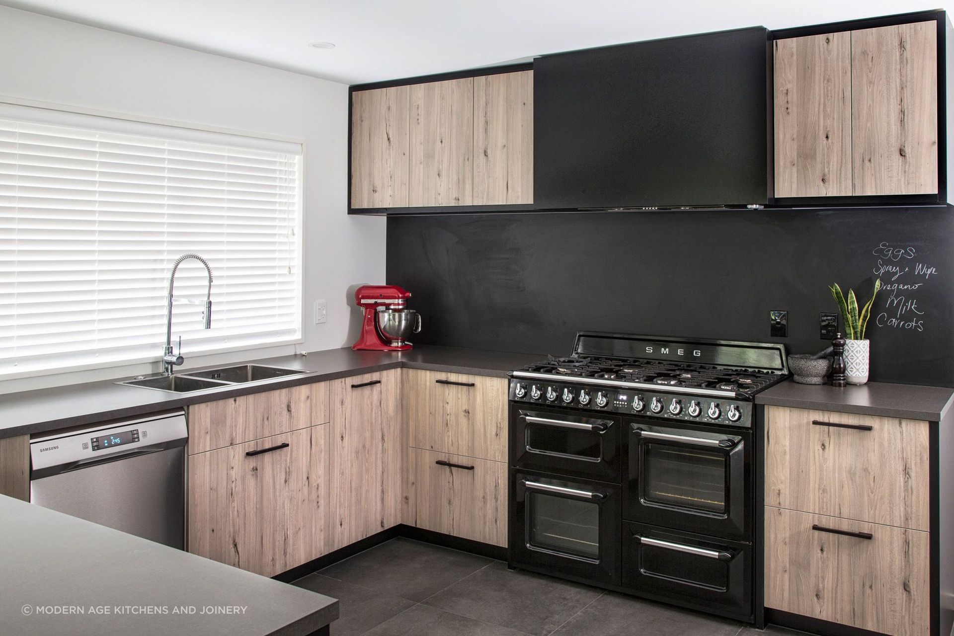 Kitchen appliances can also be used for design purposes, like a vibrant injection of colour seen in this Parklands Kitchen by Modern Age Kitchens and Joinery.