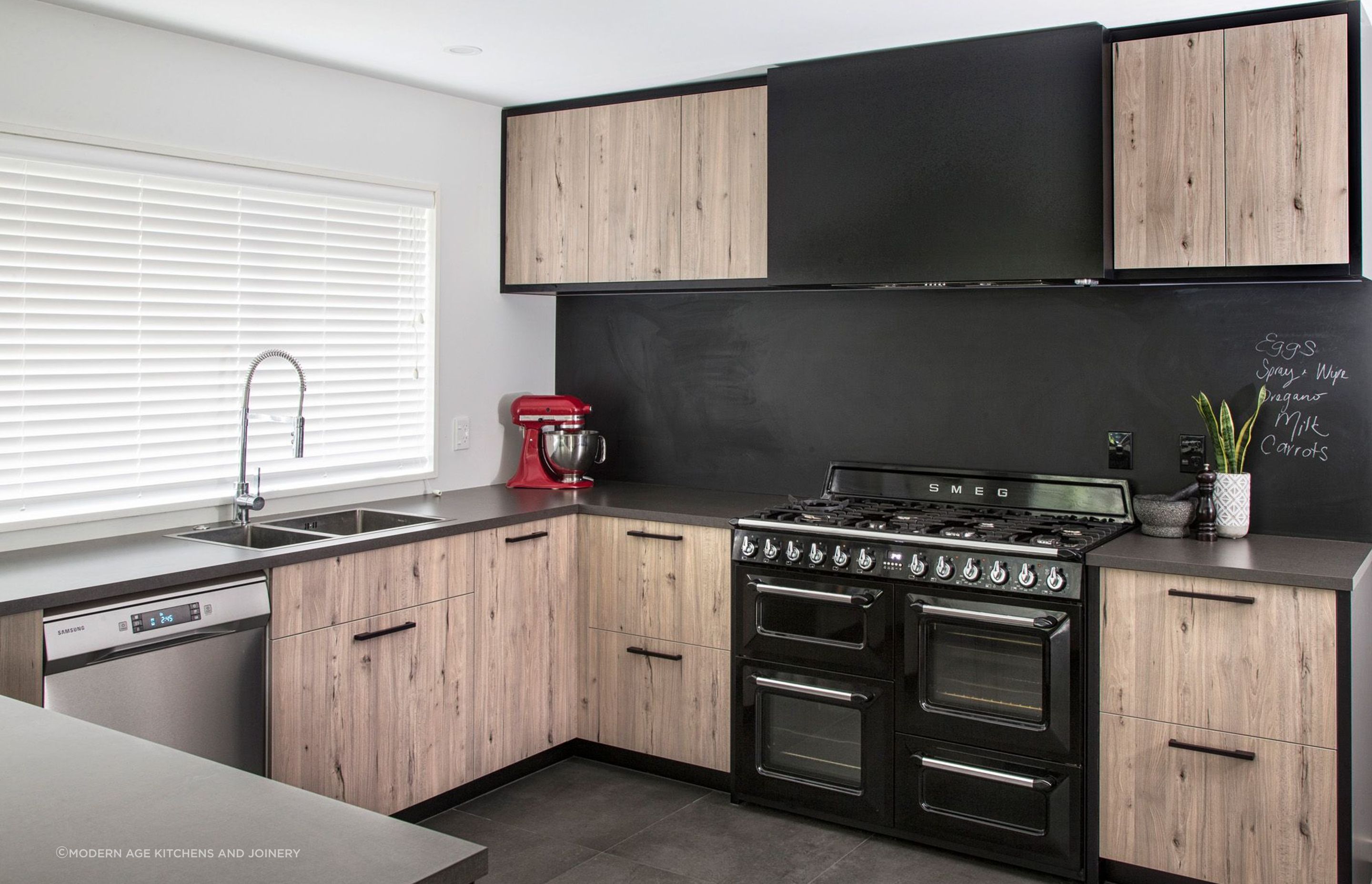 Kitchen appliances can also be used for design purposes, like a vibrant injection of colour seen in this Parklands Kitchen by Modern Age Kitchens and Joinery.