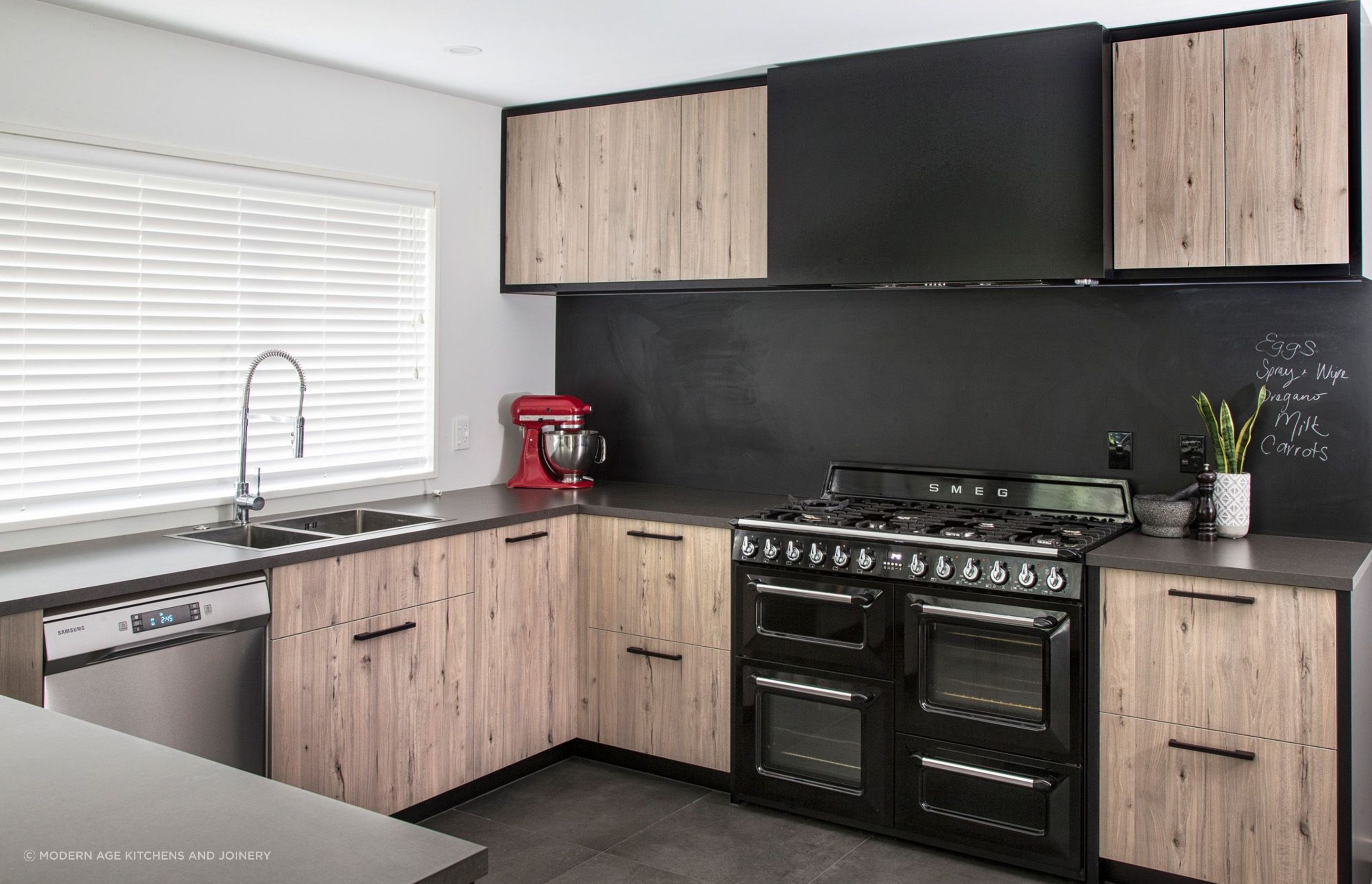 Kitchen appliances can also be used for design purposes, like a vibrant injection of colour seen in this Parklands Kitchen by Modern Age Kitchens and Joinery.