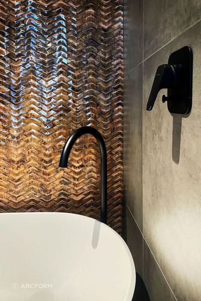 A copper partition adds warmth and an air of luxury to the bathroom.