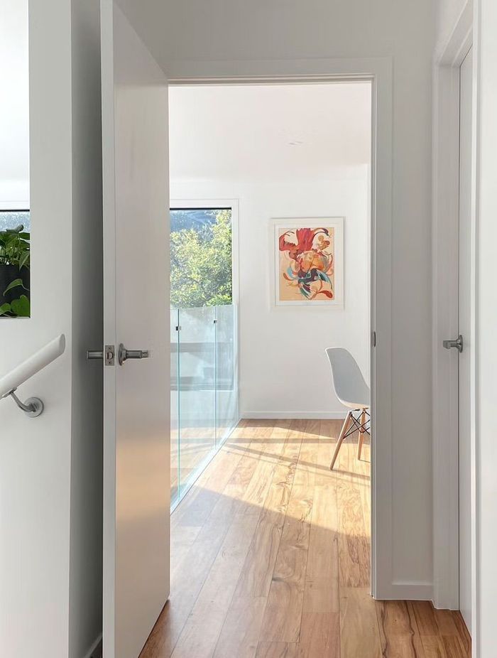 Rimu floors were chosen to soften the starkness of the white interior.