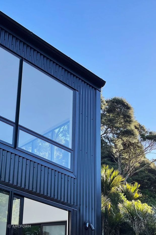 The black corrugated iron cladding pays homage to classic Kiwi building materials.