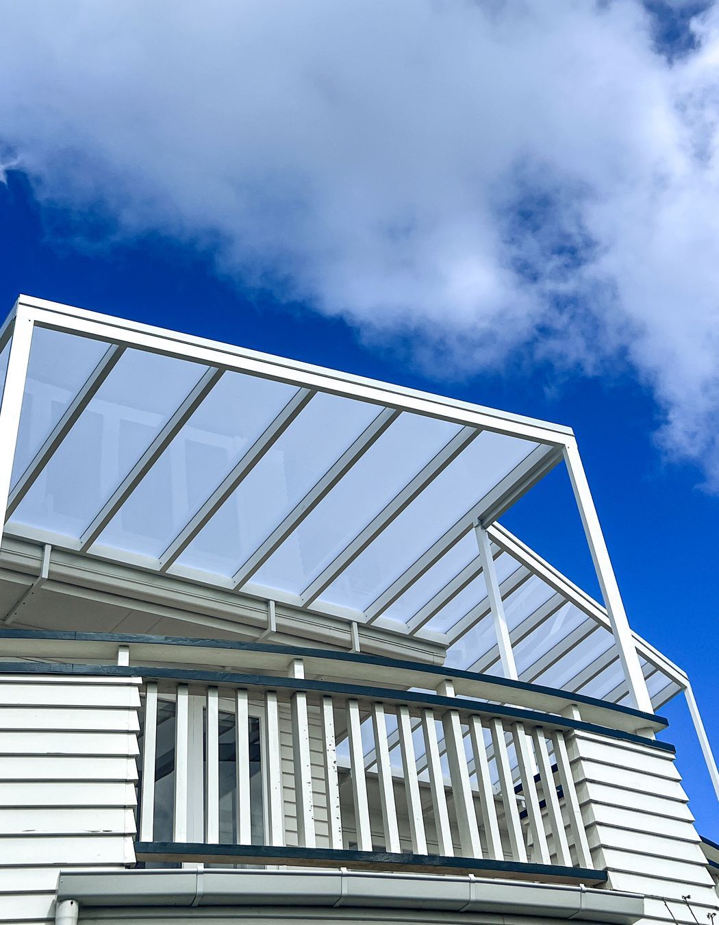 When integrating a pergola with an existing building it's crucial to customise the colour to match.