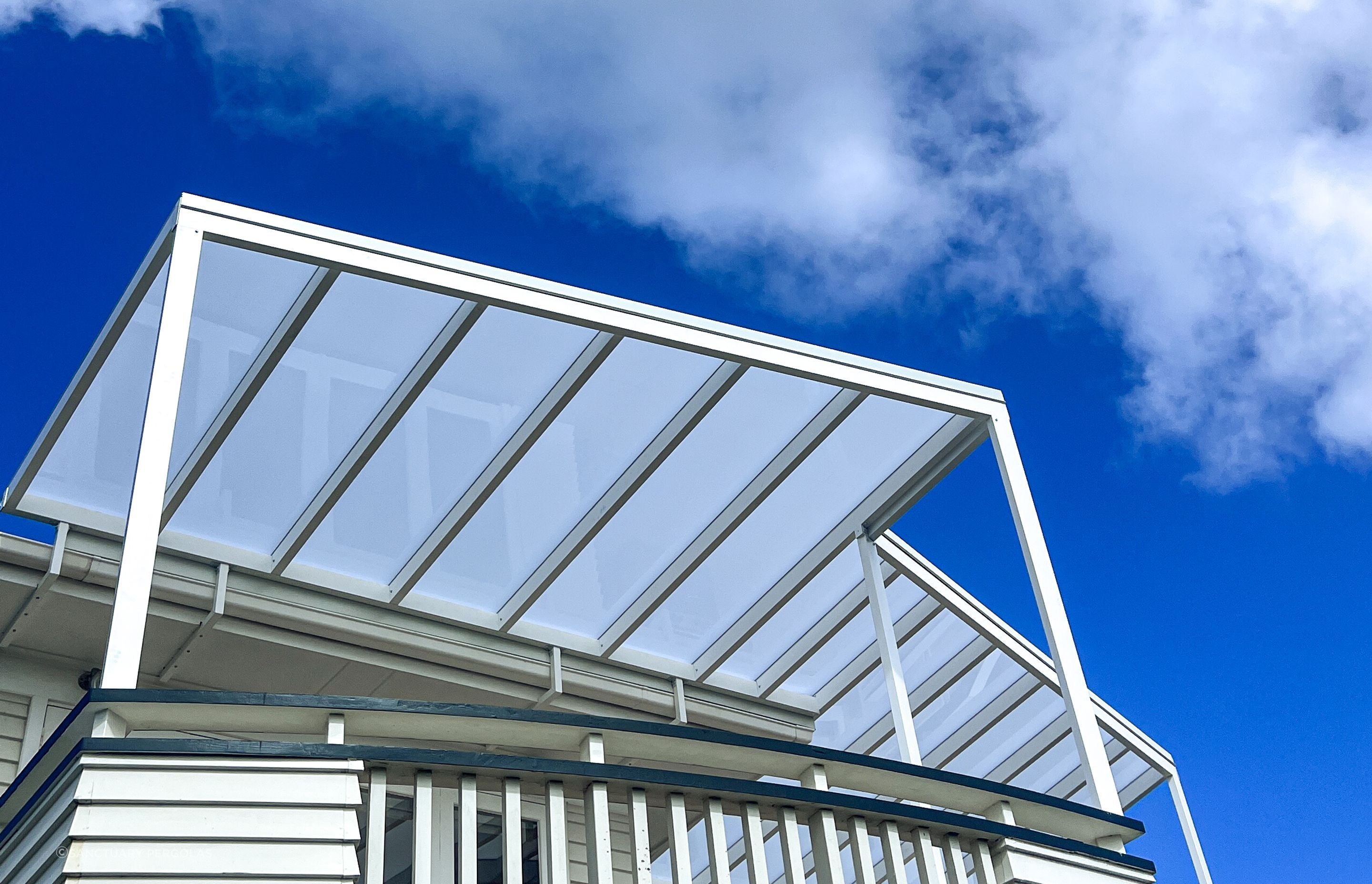 When integrating a pergola with an existing building it's crucial to customise the colour to match.