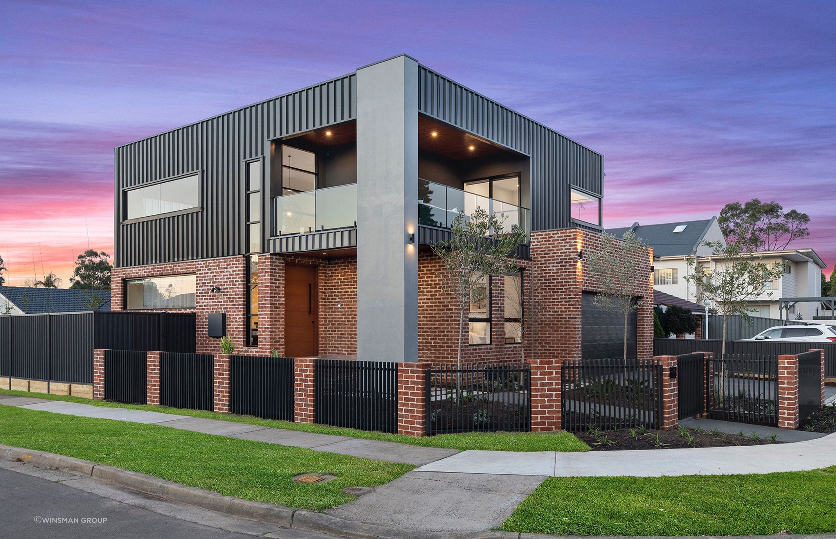  The contrast between the rustic brick, concrete forms and sharp-lined cladding is striking. Featured project: Sammut.