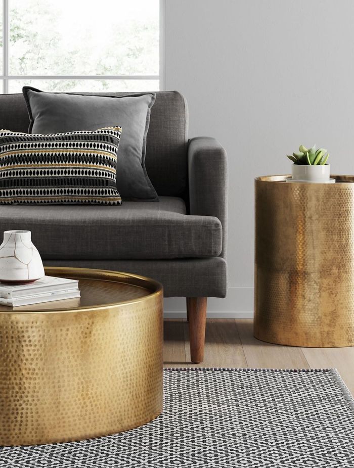 This intricately hammered barrel coffee table showcases a distinctive and elegant design.