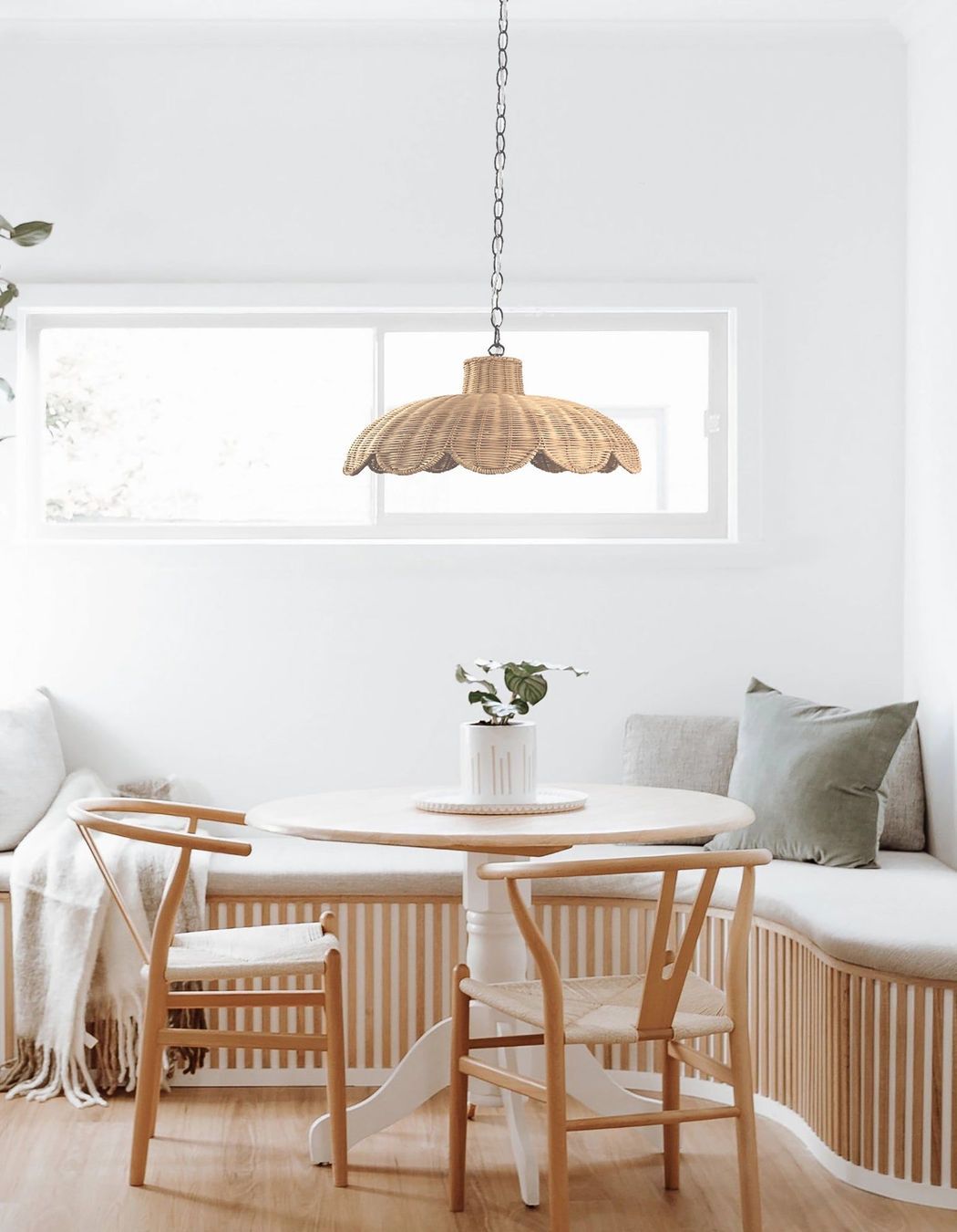 The Alice Scallop Rattan Pendant Light by Ivory &amp; Deene has a relaxed and natural quality in design and texture.