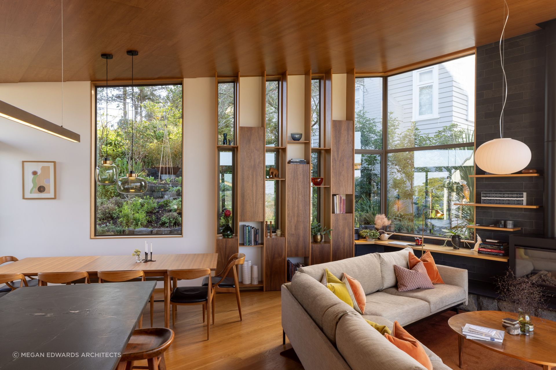 A non-linear furniture arrangement delineates different uses of the space in this open plan.