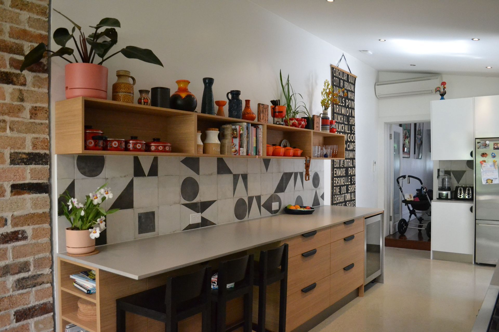 Overhead cupboards can be a good storage solution in addition to a functional kitchen bench, particularly in a smaller kitchen.