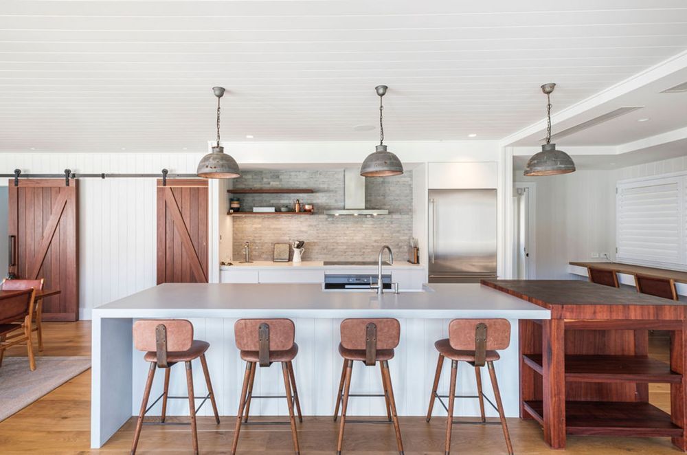 Industrial or farmhouse pendant lights add a rustic appeal to a kitchen.