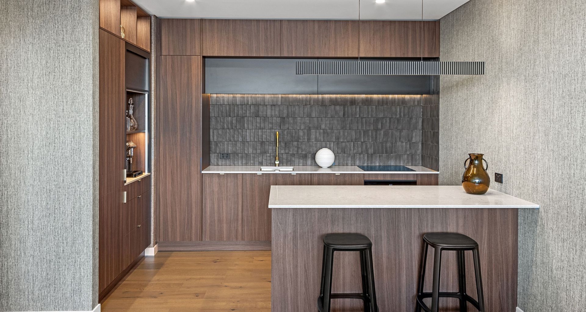 'Inner City Soul' Project by Kitchen Studio harnesses earthy tones, textural tiles and wallpaper and natural light to open up the space. Photography Credit: Geoff Trotter.