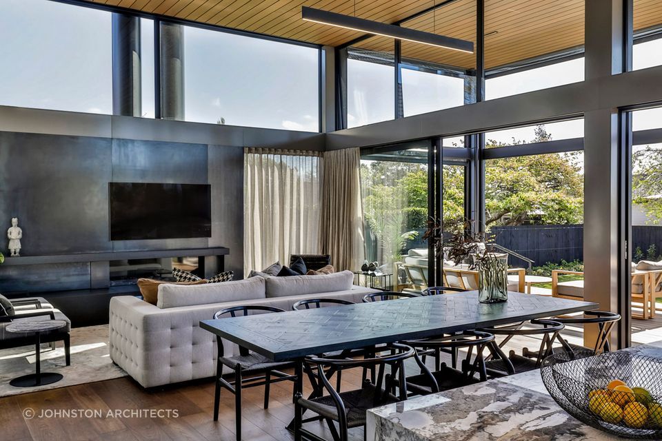 Beautiful and modern dining and living room were designed by Johnston Architects.