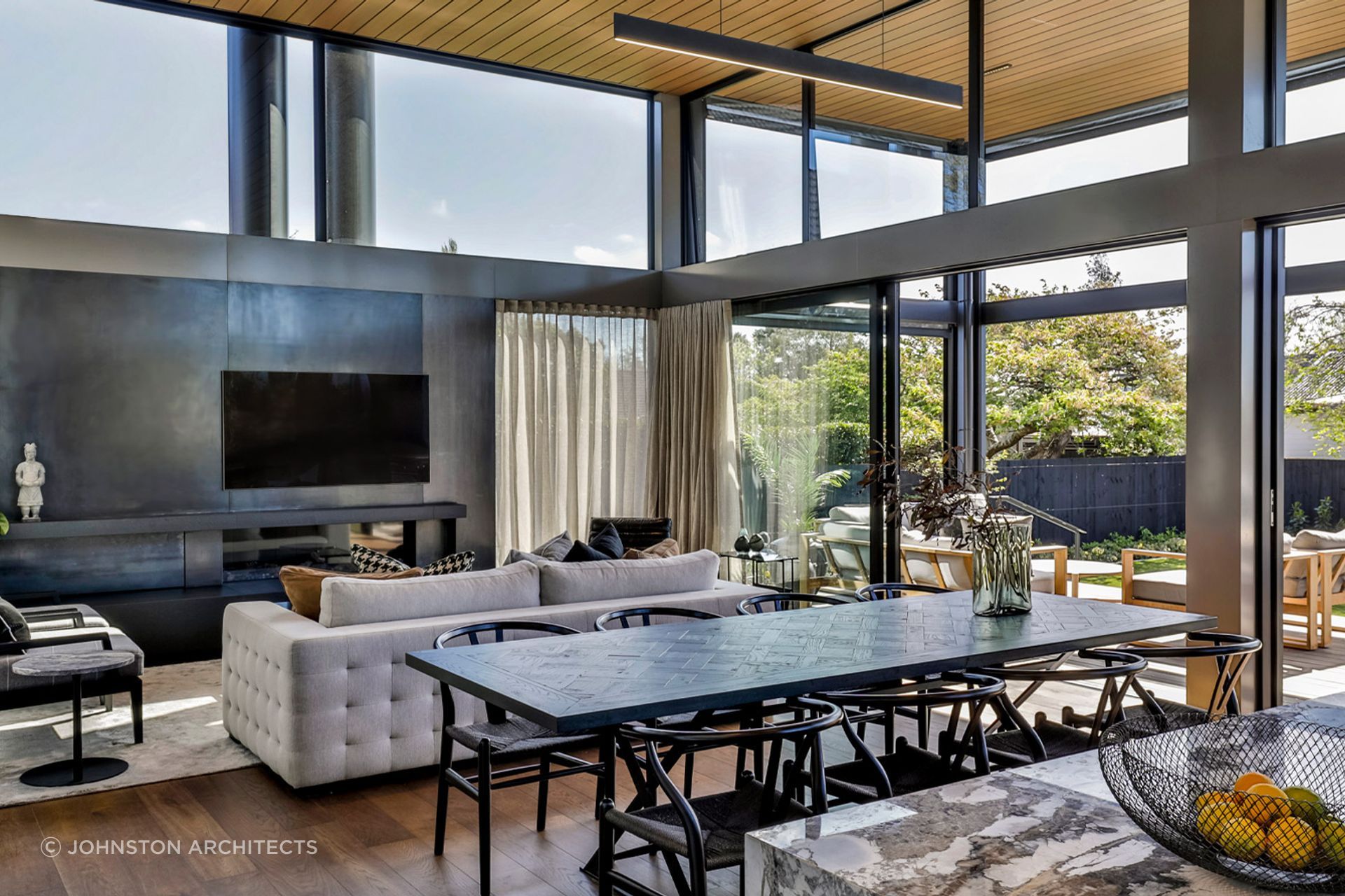 Beautiful and modern dining and living room were designed by Johnston Architects.