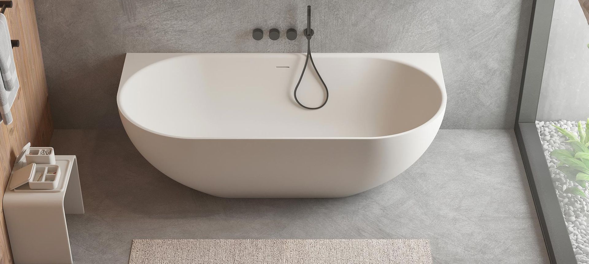 The Justina Back-to-Wall Stone Bath.