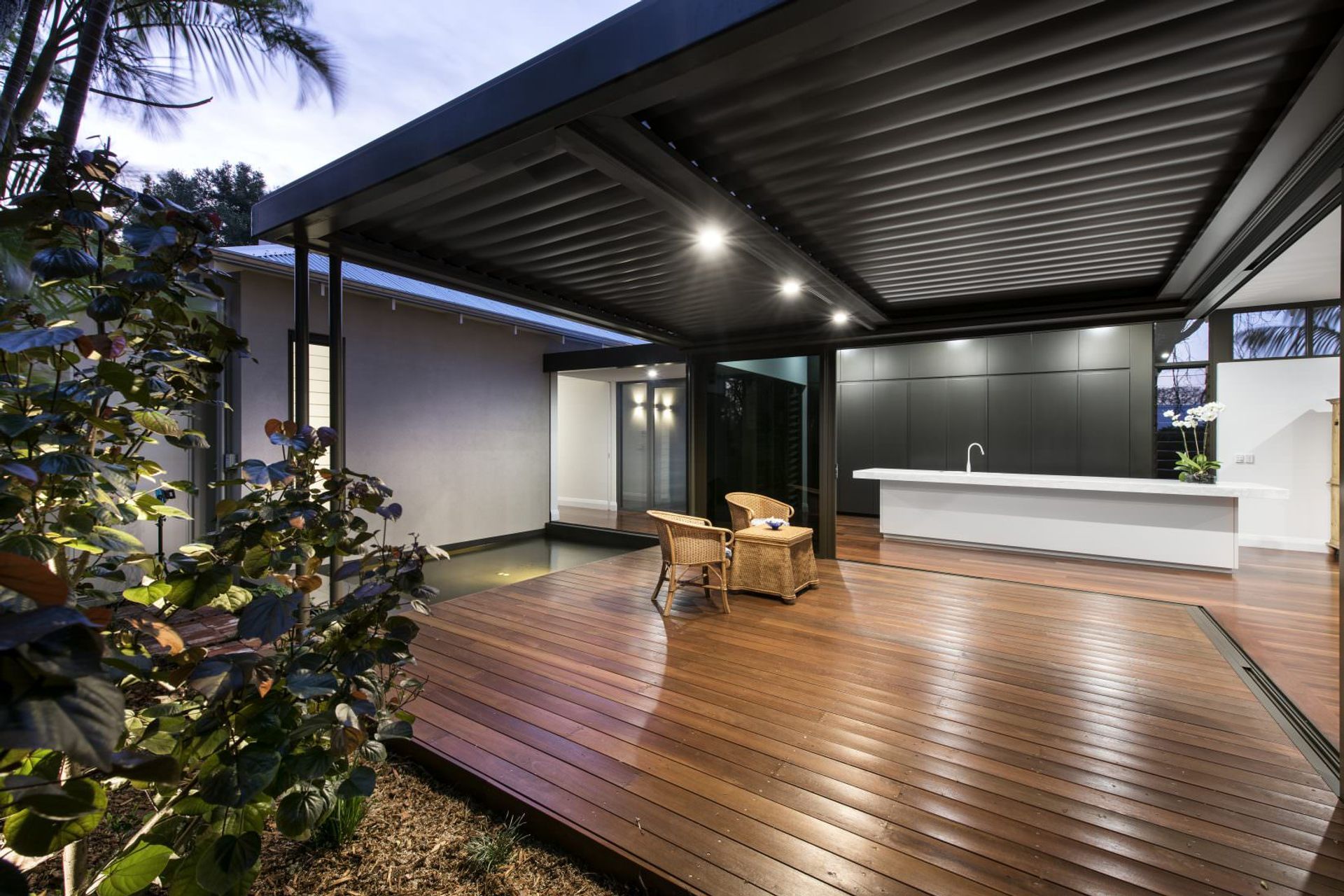 Jarrah decking highlights its deep reddish-brown tones, offering durability and a distinct charm to outdoor areas