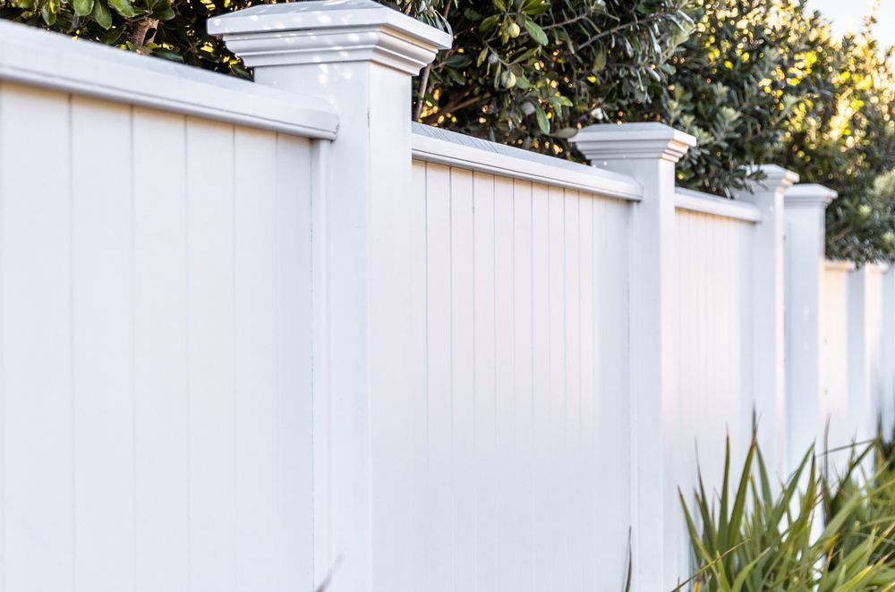 A solid timber fence supported by the GenLam Fencing System from South Pacific Timber.