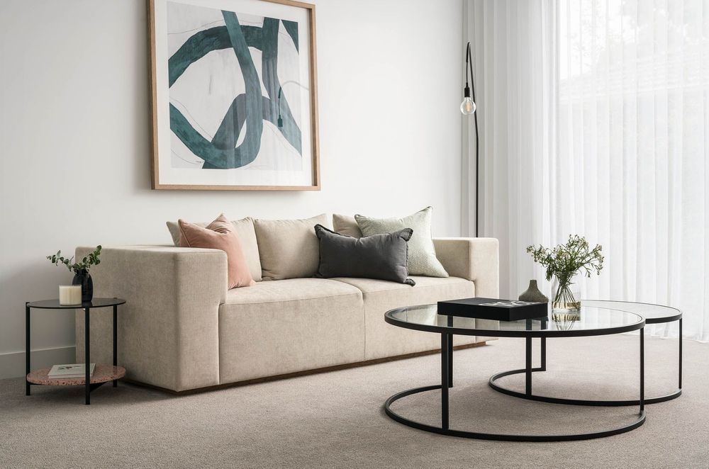 With its reflective surface, a glass coffee table brightens every corner, amplifying light and colour.