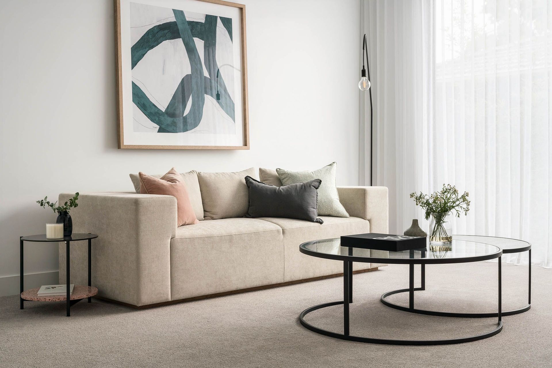 With its reflective surface, a glass coffee table brightens every corner, amplifying light and colour.