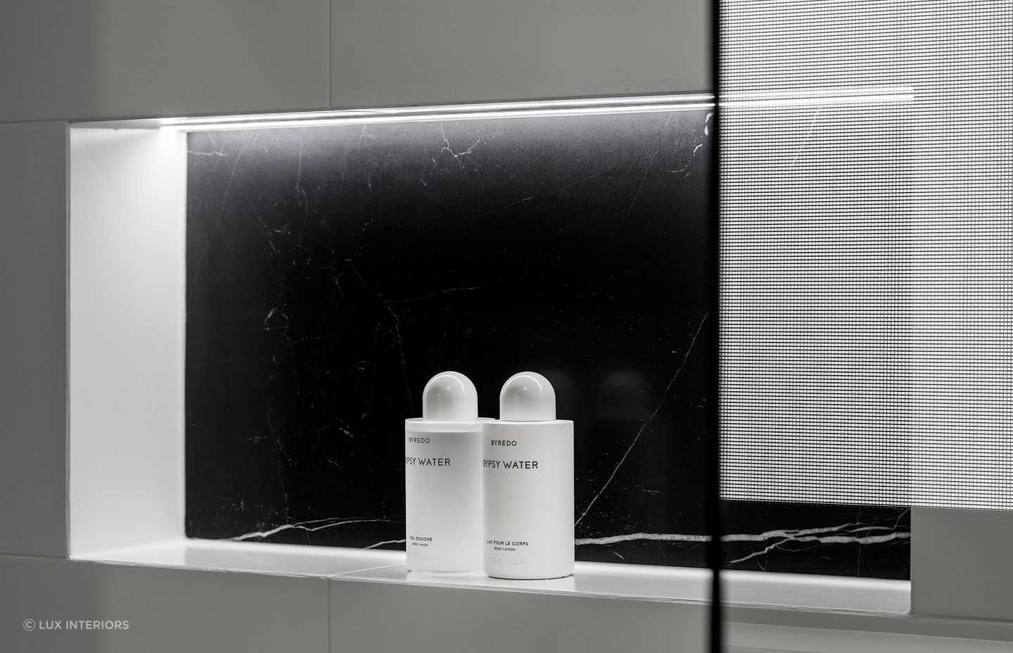 Recessed shelving is lit up from undercabinet lighting in 
Huntriss Project - Ensuite
By Lux Interiors for convenience