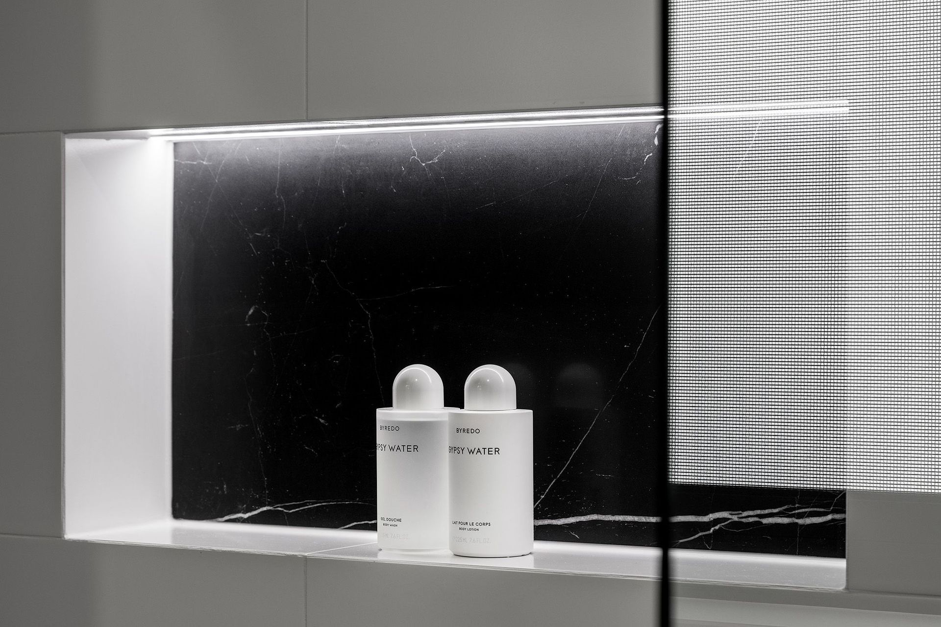 Recessed shelving is lit up from undercabinet lighting in 
Huntriss Project - Ensuite
By Lux Interiors for convenience