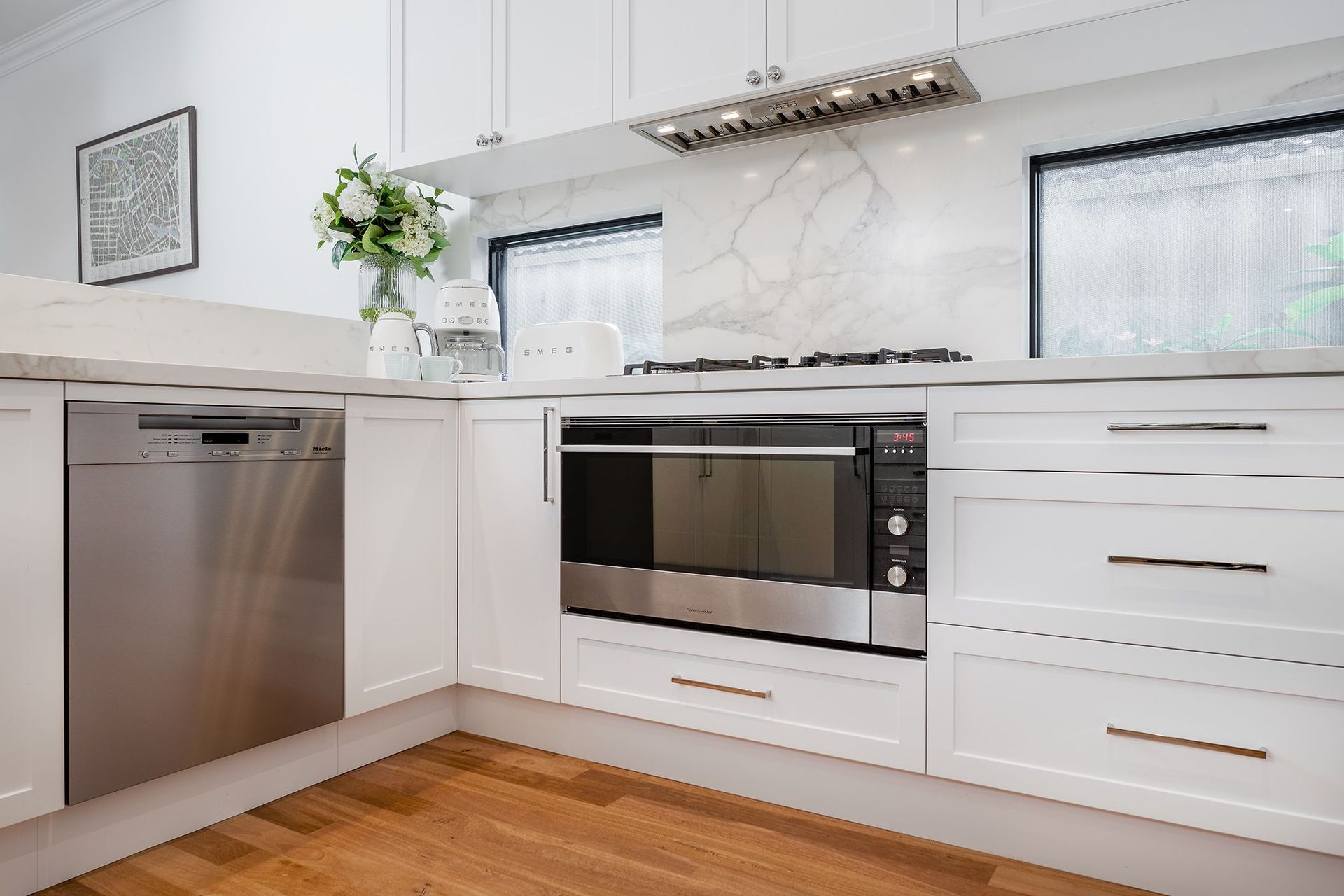 A collection of Smeg small appliances makes for a cohesive look in this Hampton's style home by Lux Interiors. | Photography: Silvertone Photography