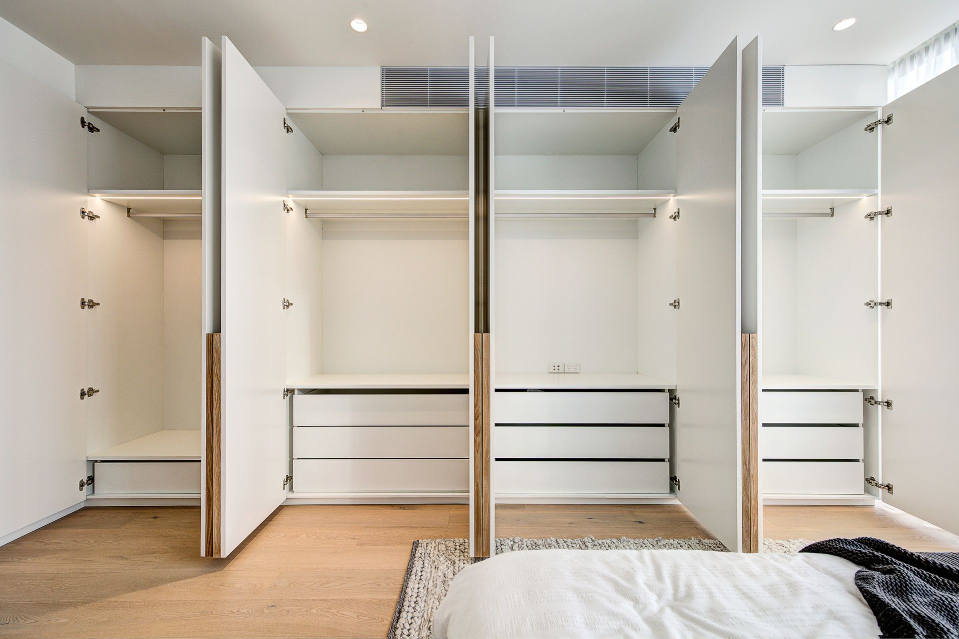 Downlights can be used to brighten specific areas in a room, such as the inside of a wardrobe Featured project: Liverpool St, Darlinghurst.
