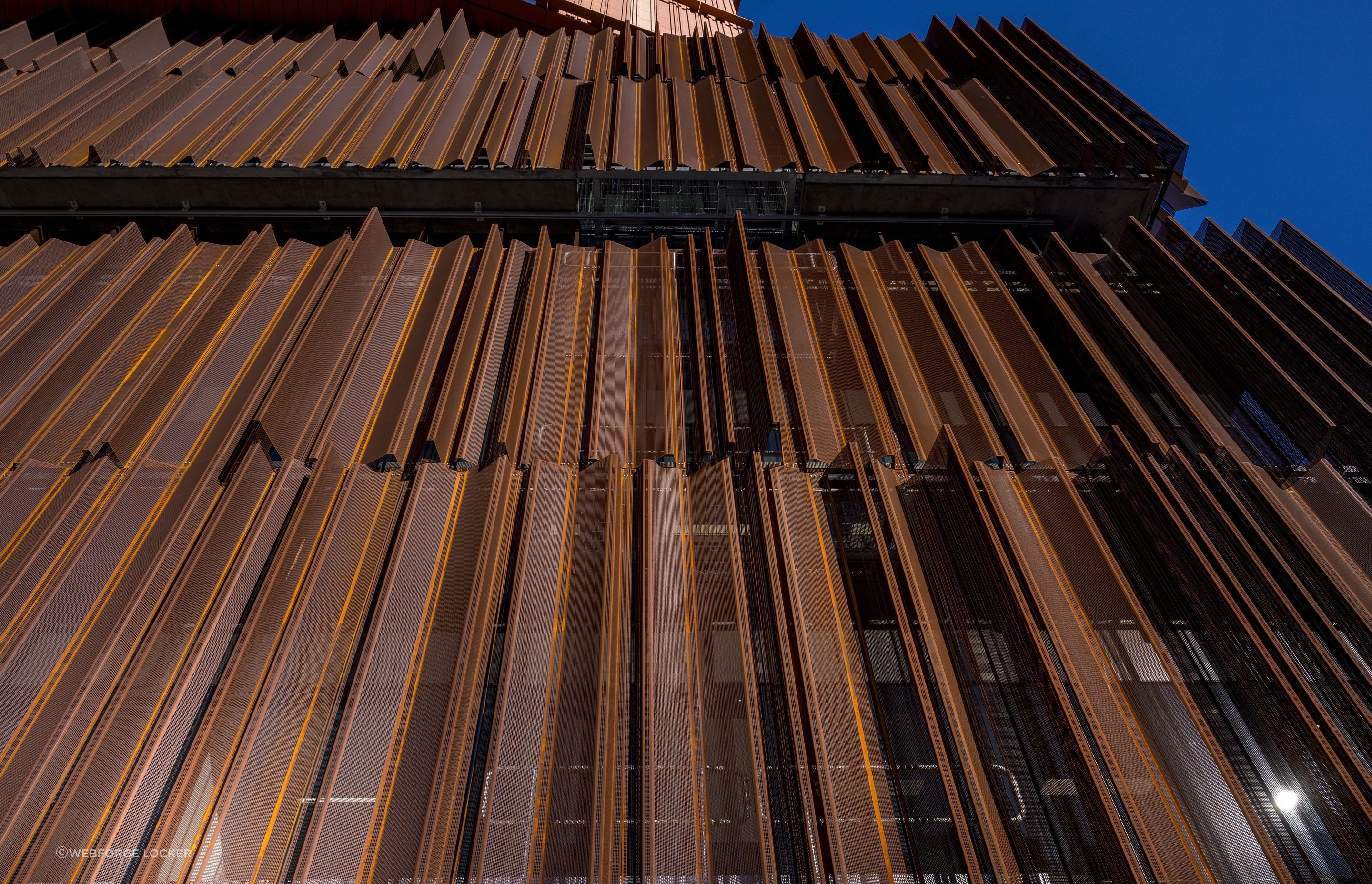 Perforated sheet cladding gives this building a stunning finish, with natural light filtering through each sheet. Featured product: Perforated Cladding.