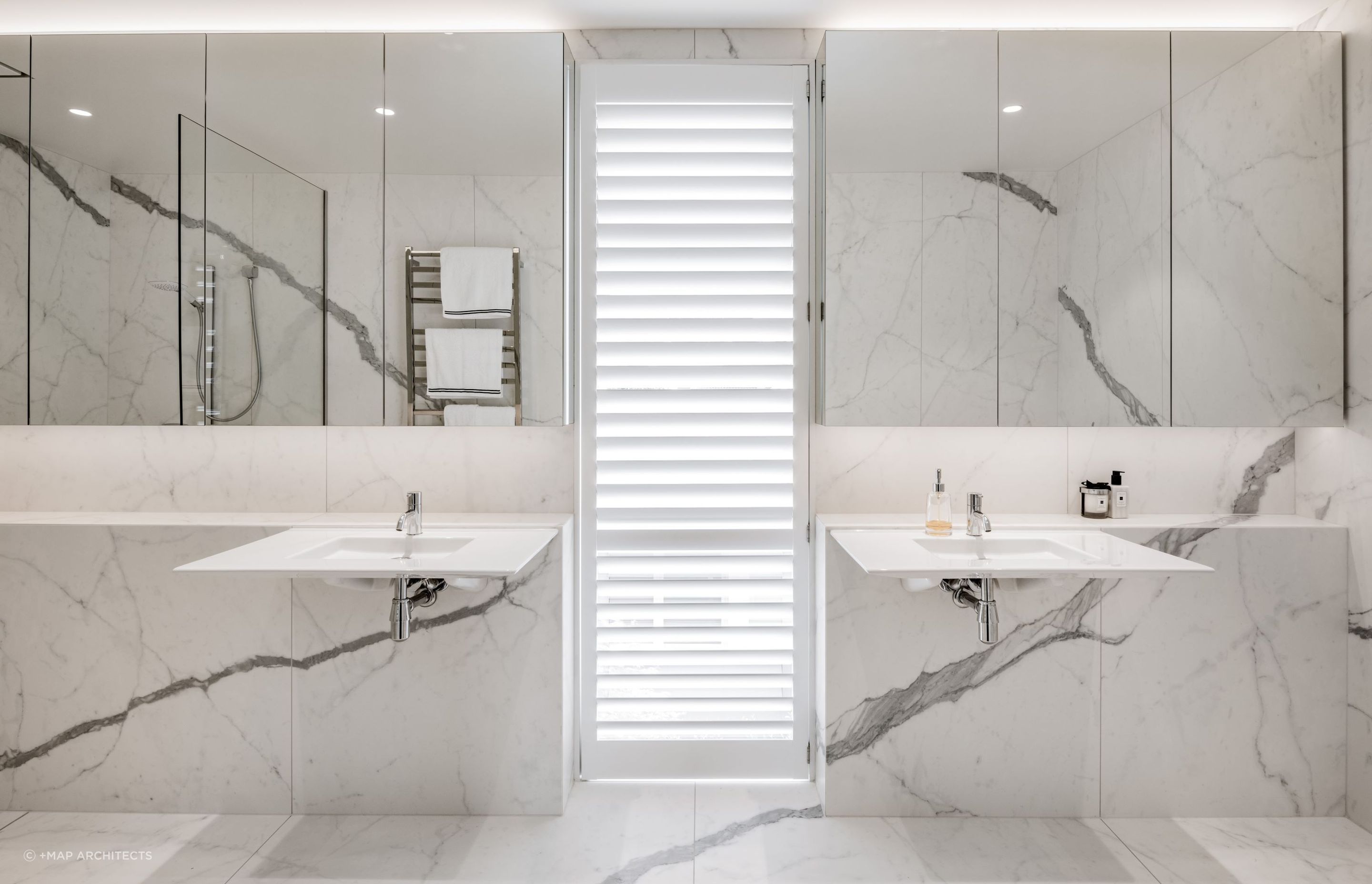 Floating sinks are a rare find but an elegant touch, seen here in the delightful Maple Courtyard House in Christchurch — Photography: Stephen Goodenough