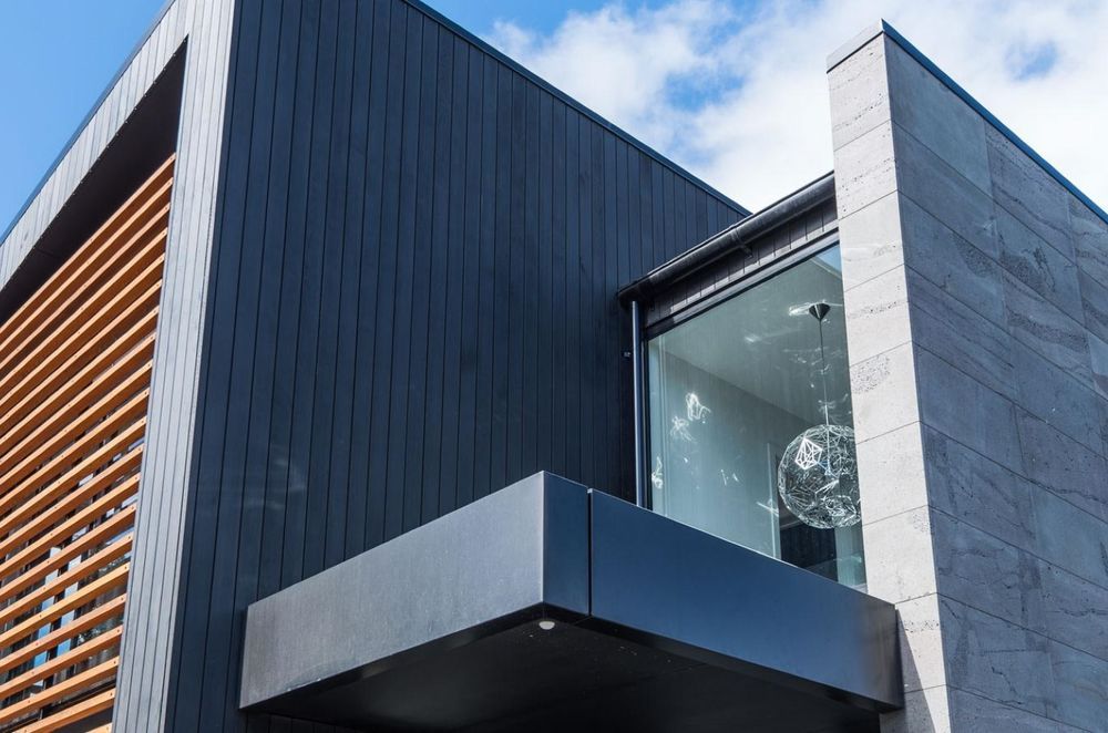 High-quality material choices make the best homes what they are, like the stunning cedar weatherboards and bluestone cladding in this Merivale home.